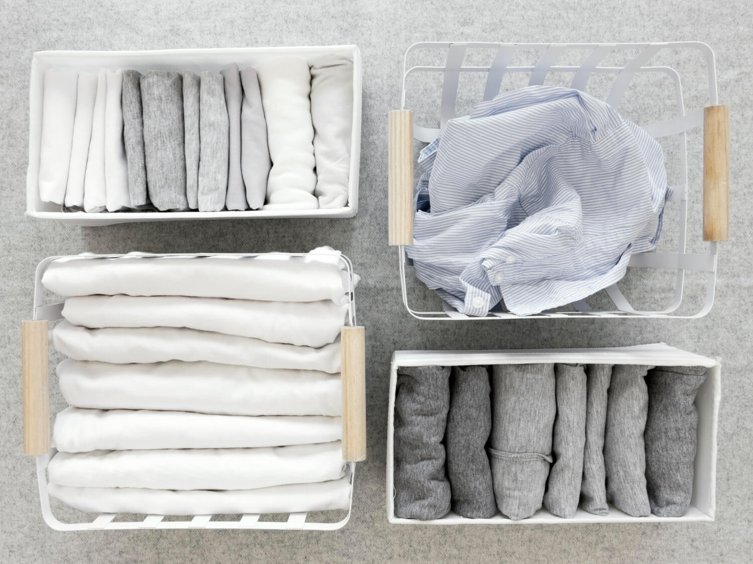 Versatile cloth baskets neatly organizing folded clothes and scarves in a wardrobe.